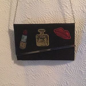 Black Clutch with removable straps.